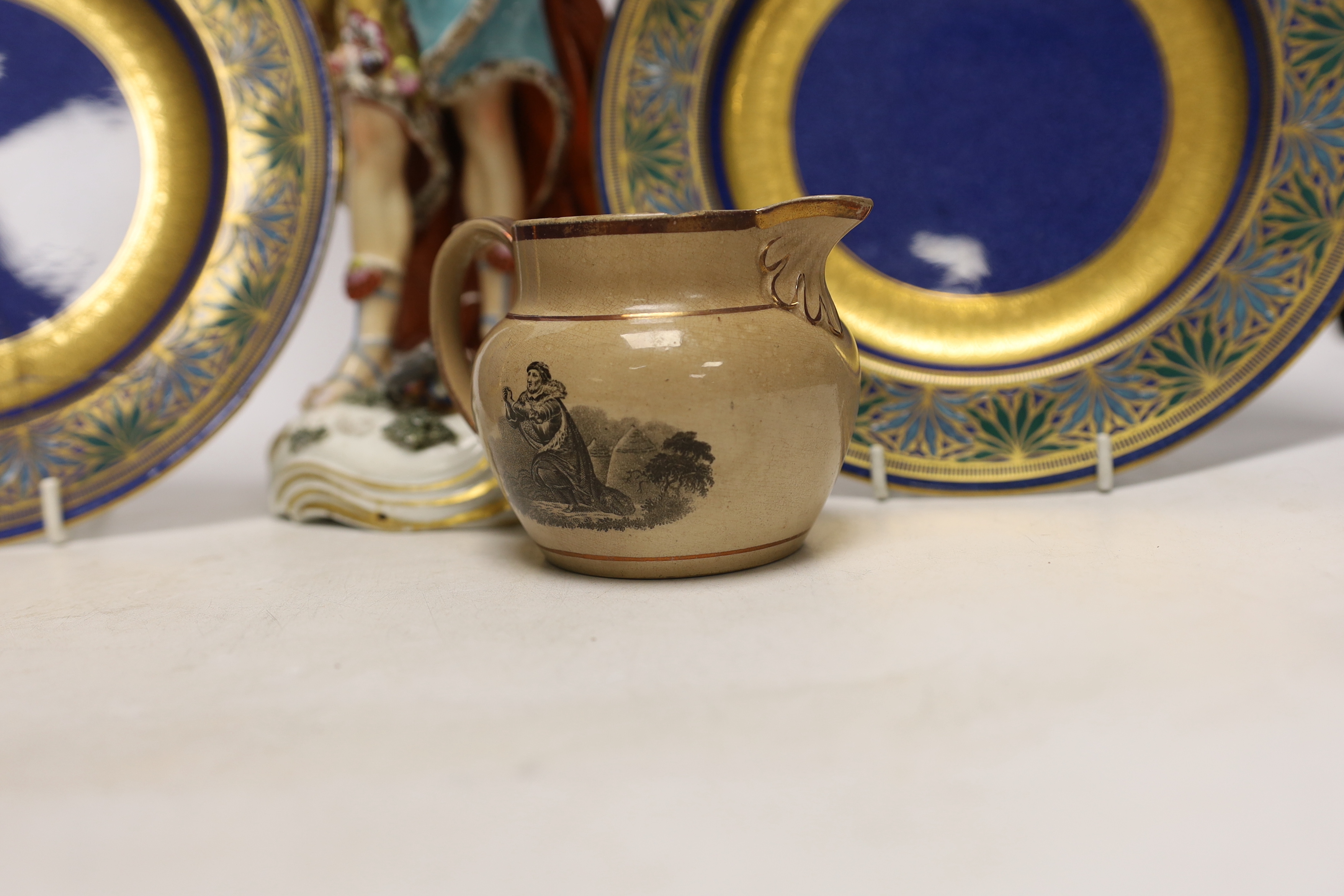 A Derby style figure of Neptune, two Wedgwood plates (one a.f.) and a Staffordshire drab ground jug, largest 32cm high